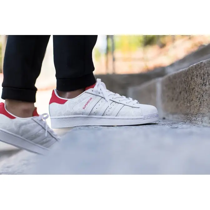 Superstar white outlet red on feet