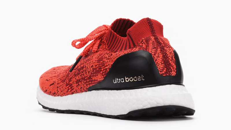 ultra boost uncaged red on feet