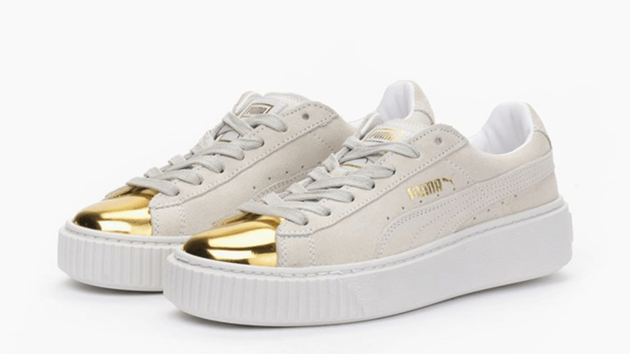 white pumas with gold tip