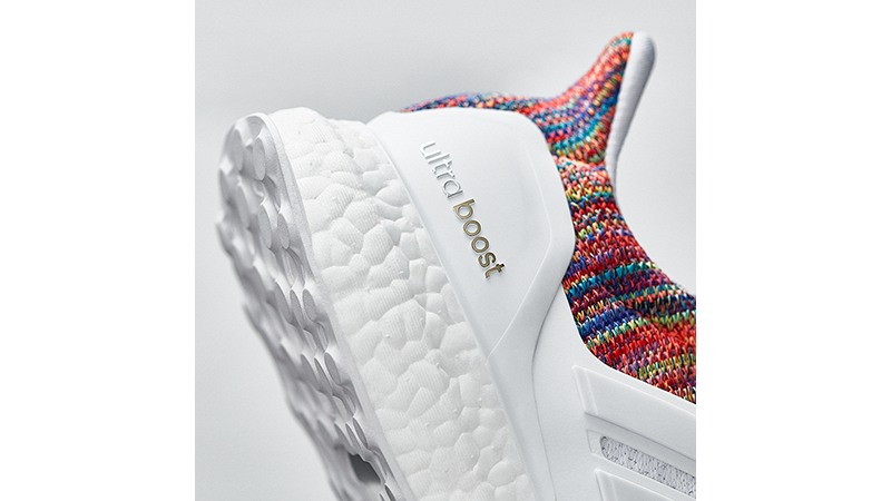 white adidas boost with rainbow