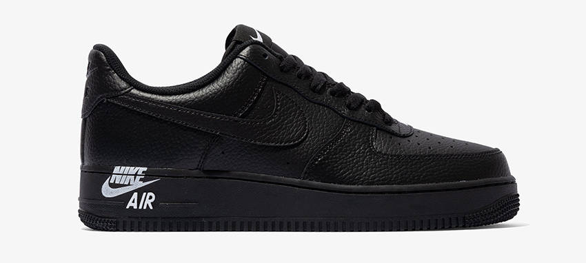 The Nike Air Force 1 Stamp Logo Follows With A Triple Black