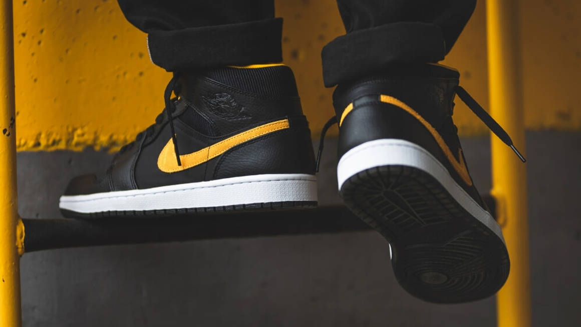 black and yellow jordans at foot locker