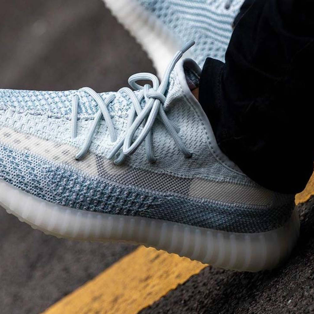 white yeezys on feet