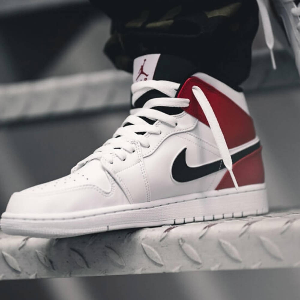 white nike trainers with red tick