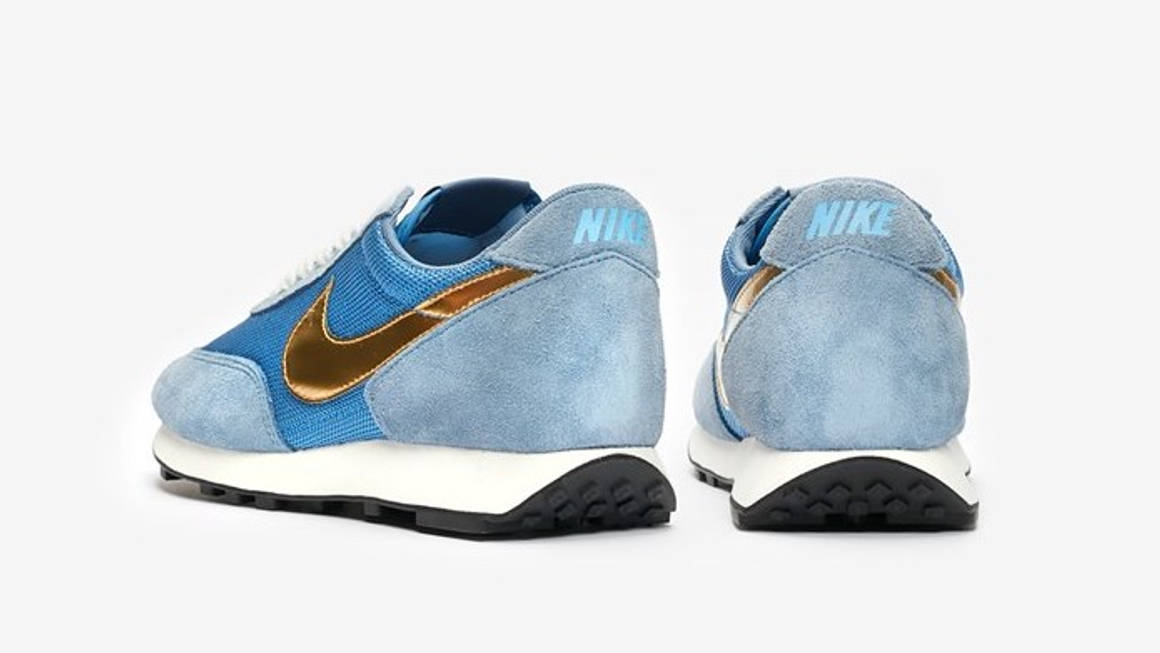 black nike with gold swoosh womens