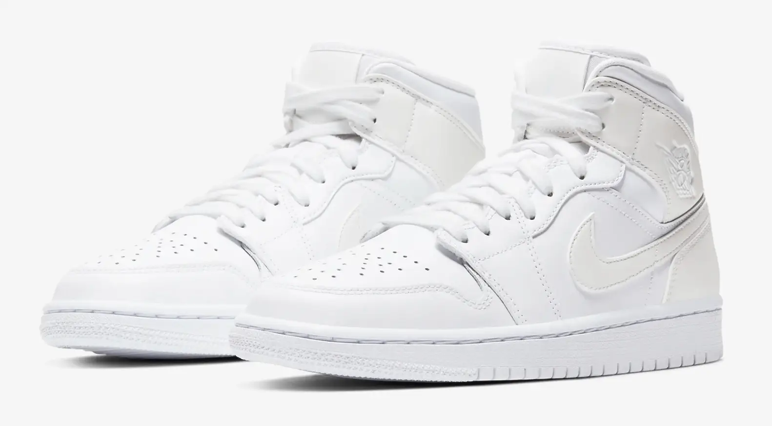 Step Out In Style In This Triple White Air Jordan 1 Mid | The Sole Supplier