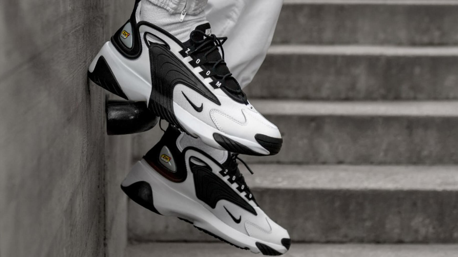 white and black zoom 2k trainers