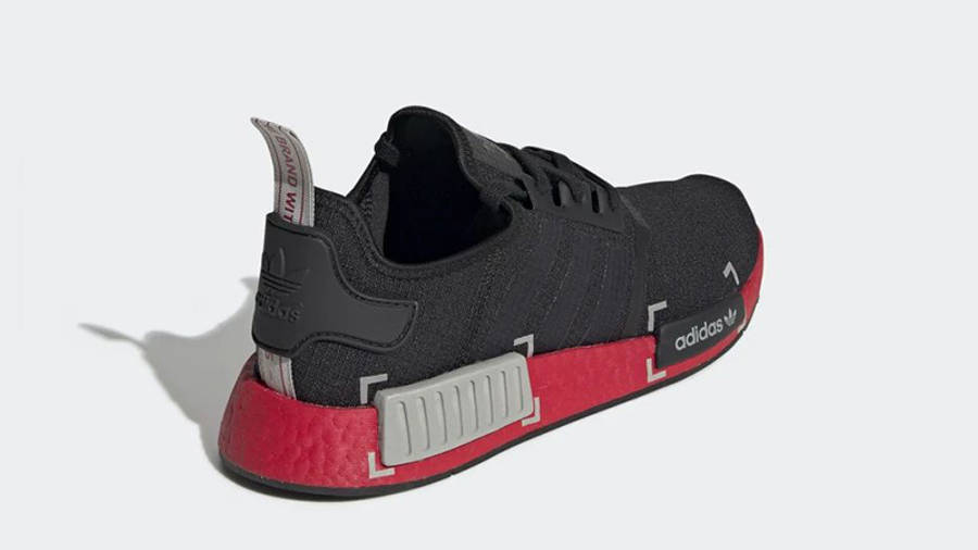 all black nmd with red