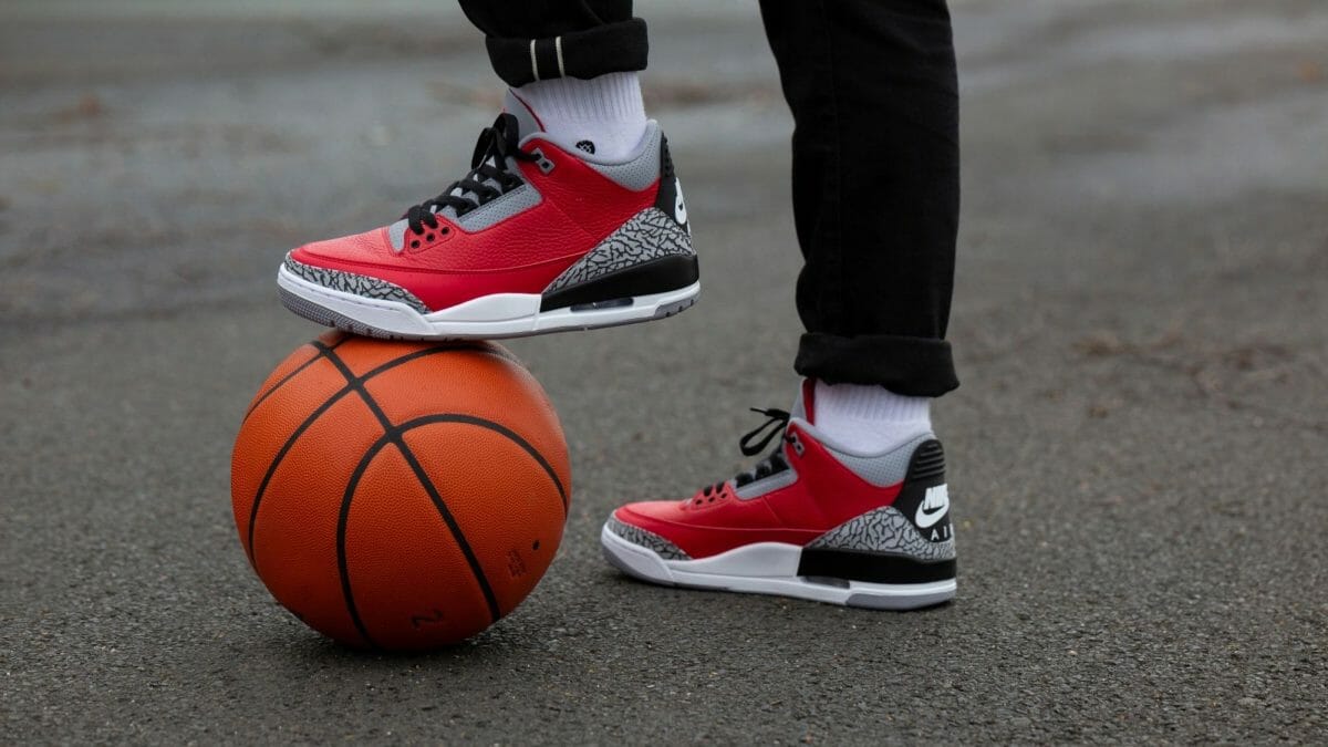 red 3s on feet