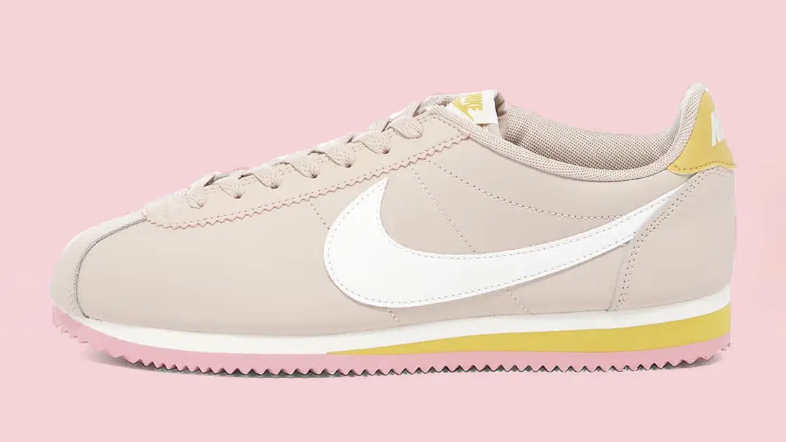 Pink and yellow nike cortez best sale