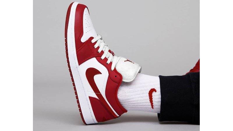 red and white low jordans