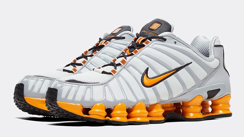 orange and white nike shox