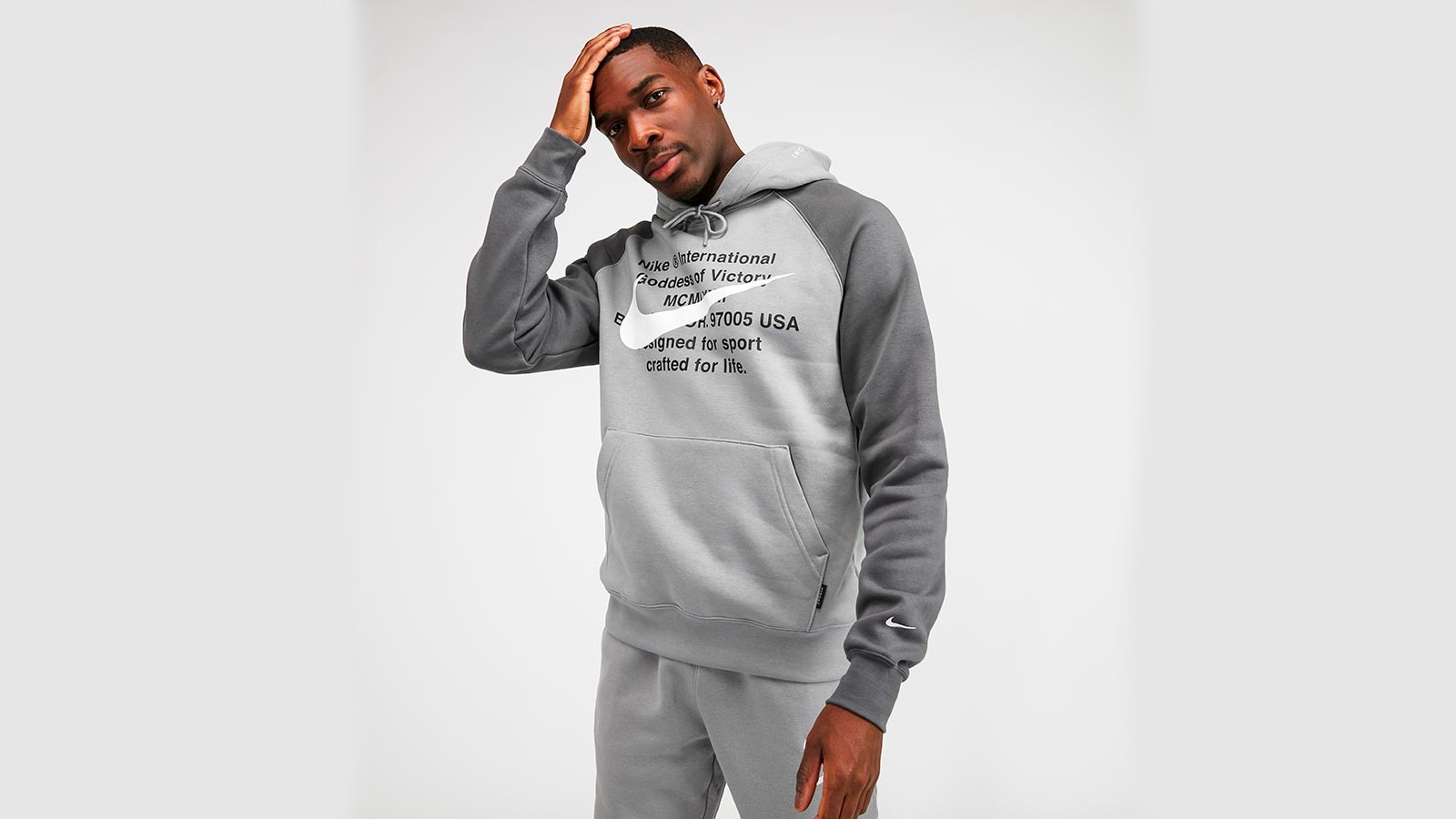 grey swoosh jumper
