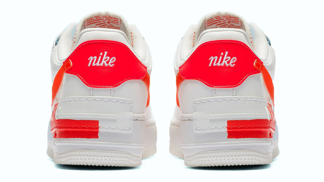 white nike with orange heel