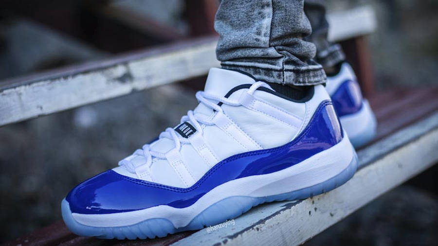 Jordan 11 Low Concord White On Foot On Bench
