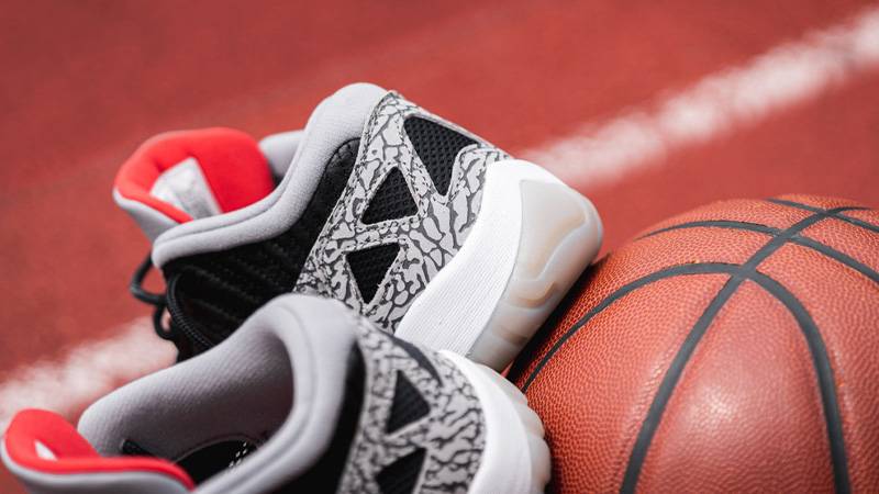 jordan 11 low black cement on feet