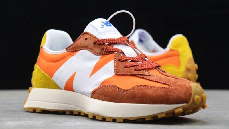 New Balance 327 Orange White Front On Floor