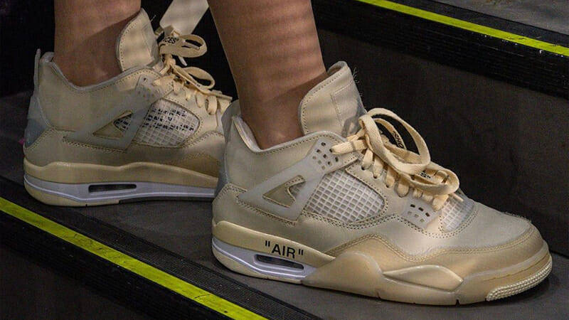 Off-White x Nike Air Jordan 4 Sail On Foot Side