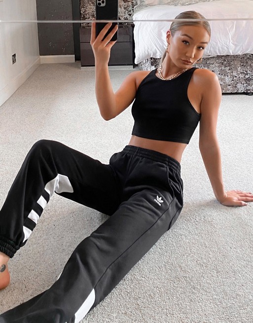 adidas Originals adicolor large logo track pants in black