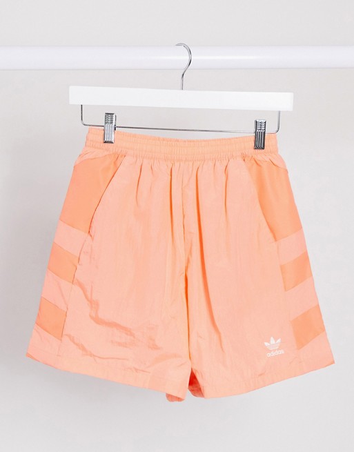 adidas Originals adicolor large logo shorts in coral