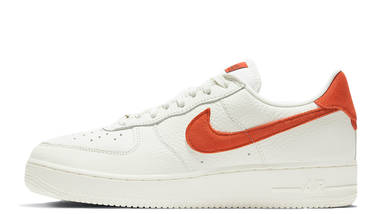 nike air force 1 trainers with red swoosh and gum sole