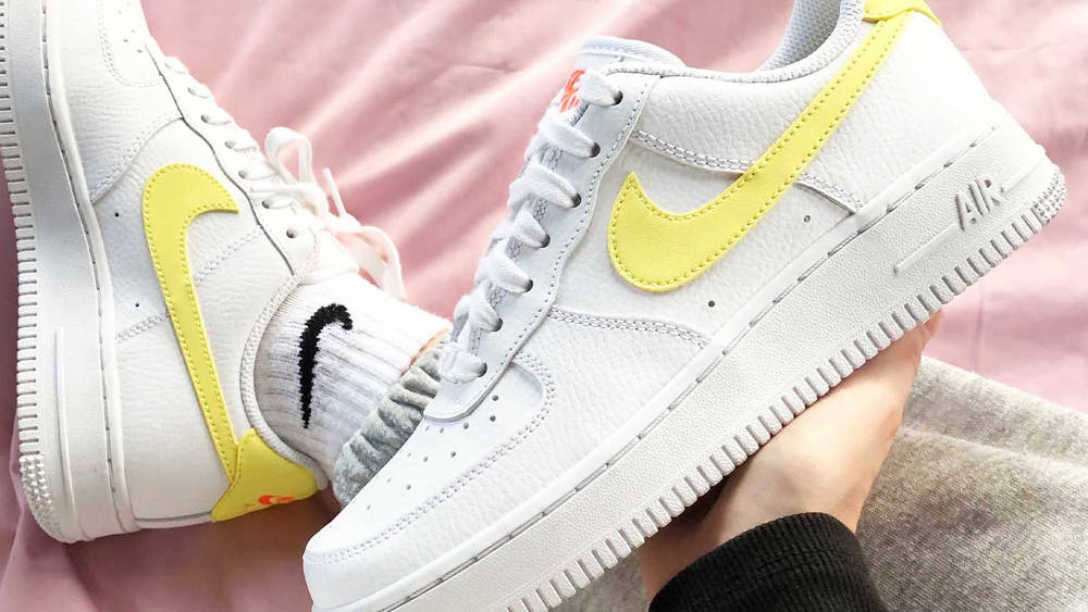 Nike air force 1 light citron in hand feature Nike air force 1 light citron in hand feature