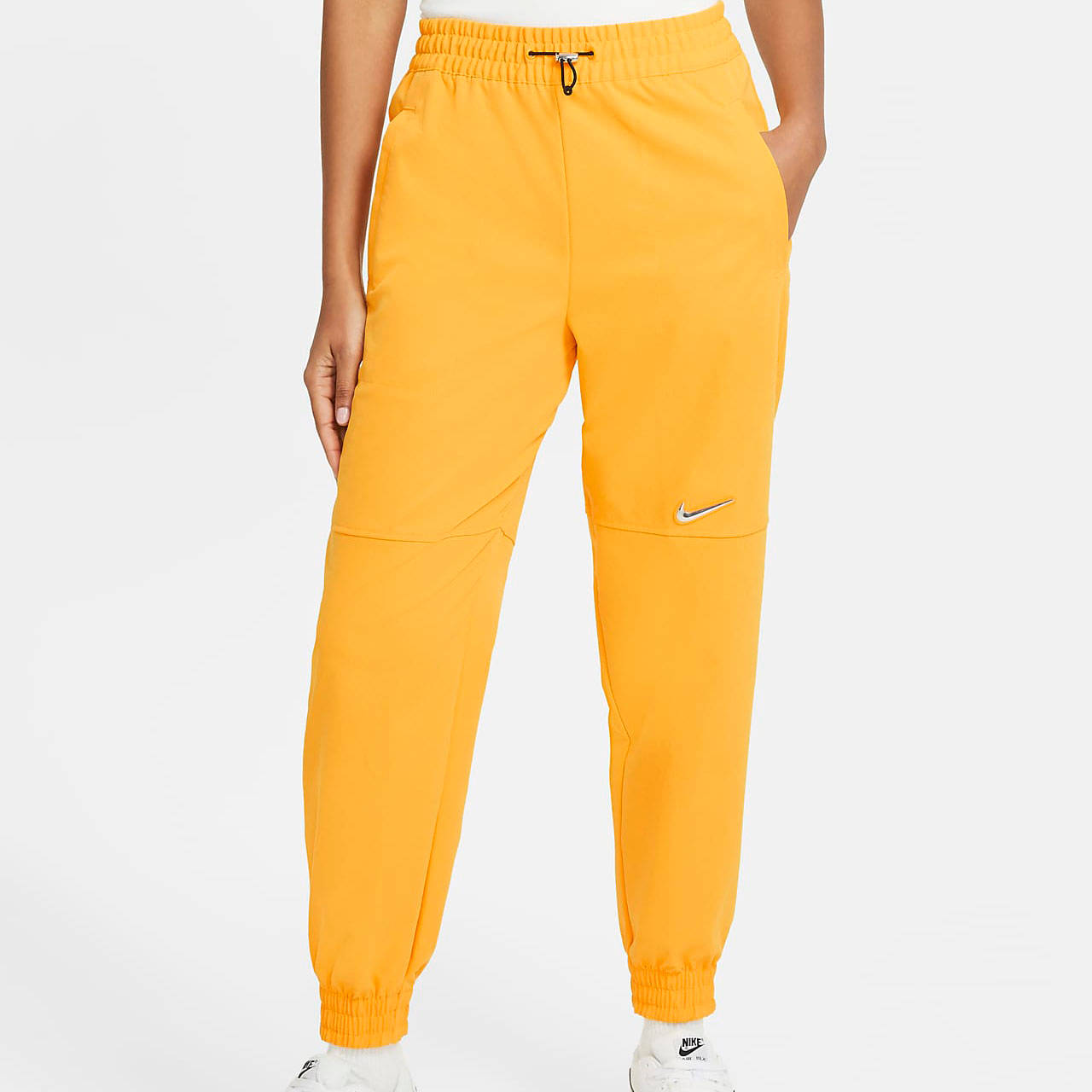 nike utility trousers orange