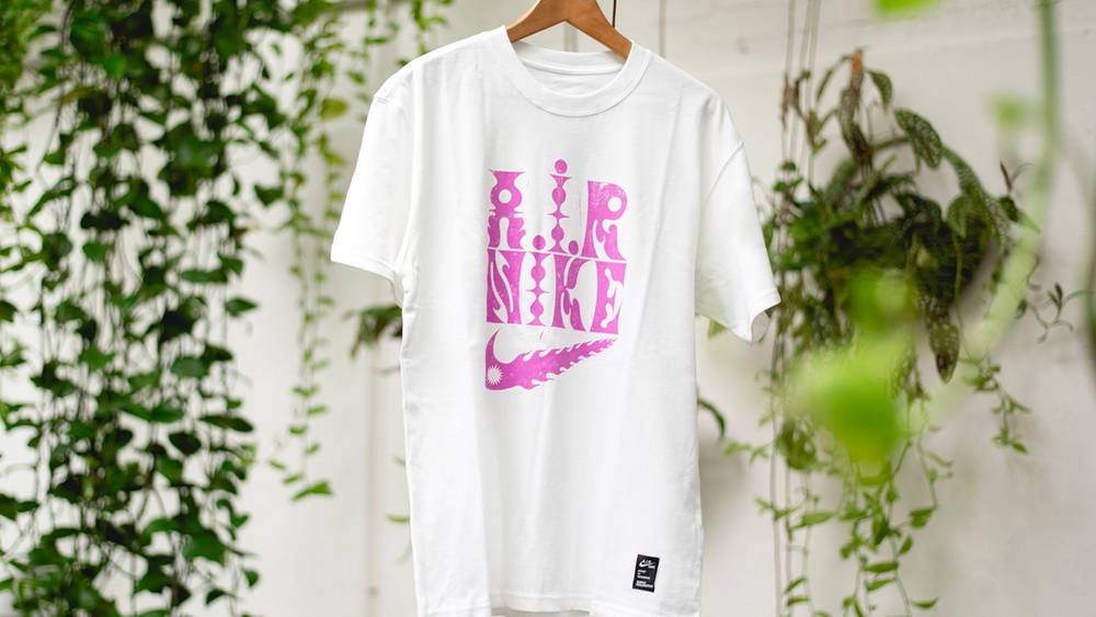 Image via The Sole Supplier The Sophy Hollington x Nike Sportswear T-Shirt Infuses Apparel With Art