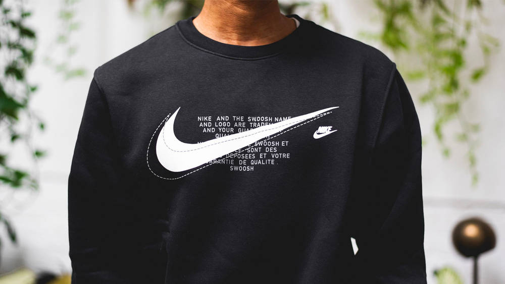 Image via The Sole Supplier The Nike Sportswear Court Fleece Crew is Swoosh Crazy