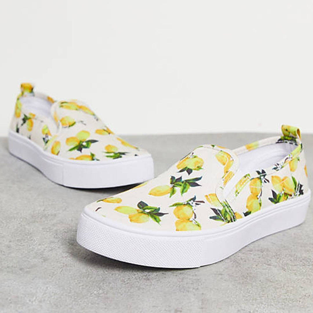 ASOS Design lemon print slip on plimsoles