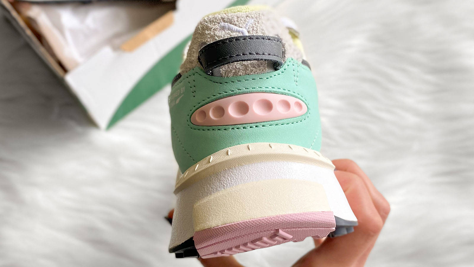 pastel puma rider in hand heel shot 4
