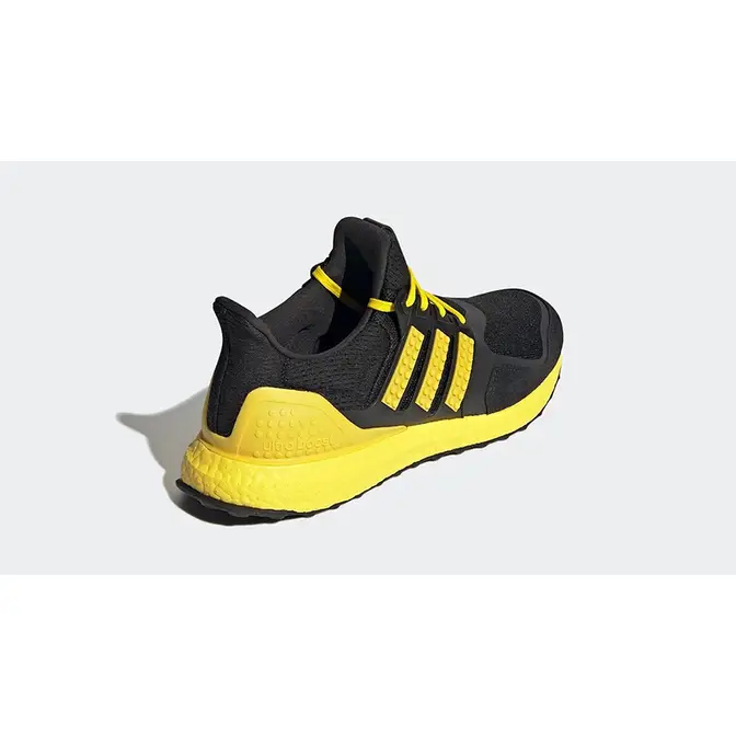 Ultra boost black store yellow