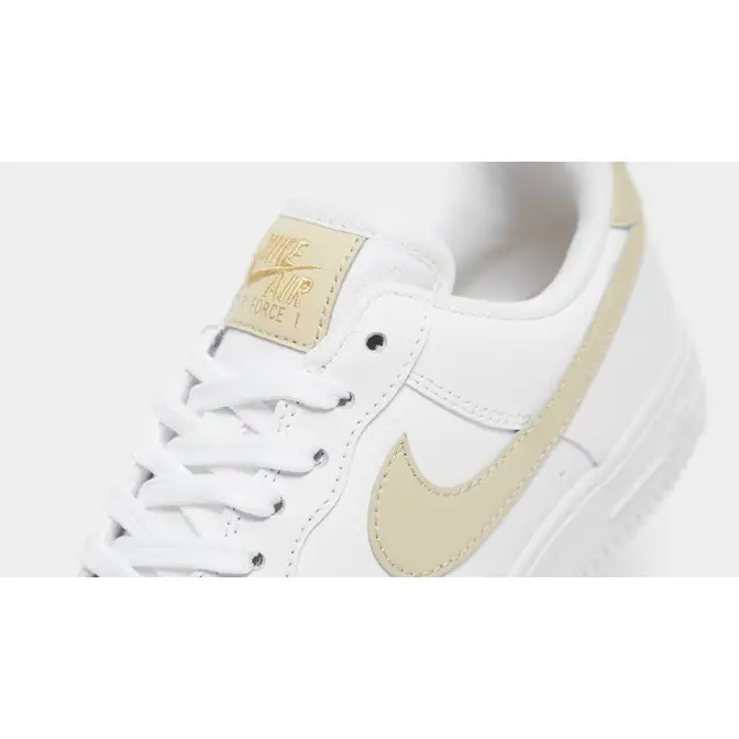 white & gold air force 1 essential trainers