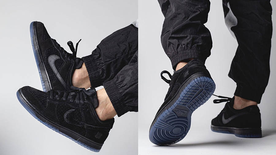 black undefeated dunks on feet