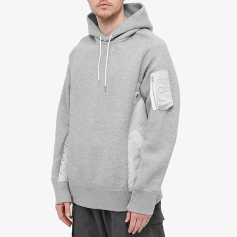 sacai x KAWS Embroidered Hoodie | Where To Buy | The Sole Supplier