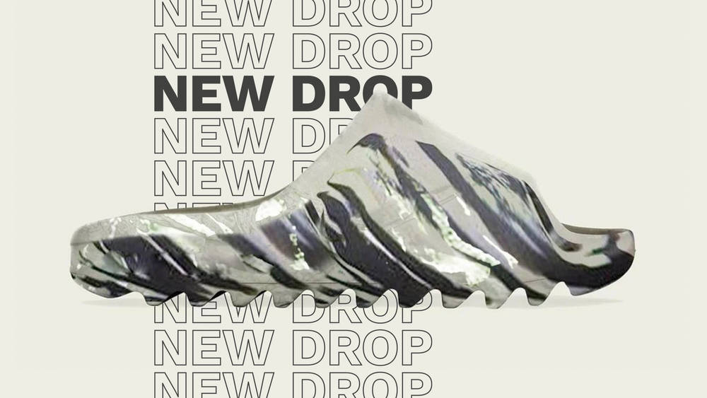 Image via yeezyinfluence This Yeezy Slide MX Is Giving Us Serious "Zebra" Vibes