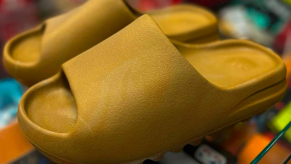 Image via requestboutiqueclt Yeezy Slide "Ochre"