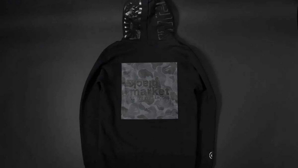 Image via Comme Des Garcons Stussy, BAPE & Vans Receive the Blackout Treatment at COMME des GARÇONS' Black Market