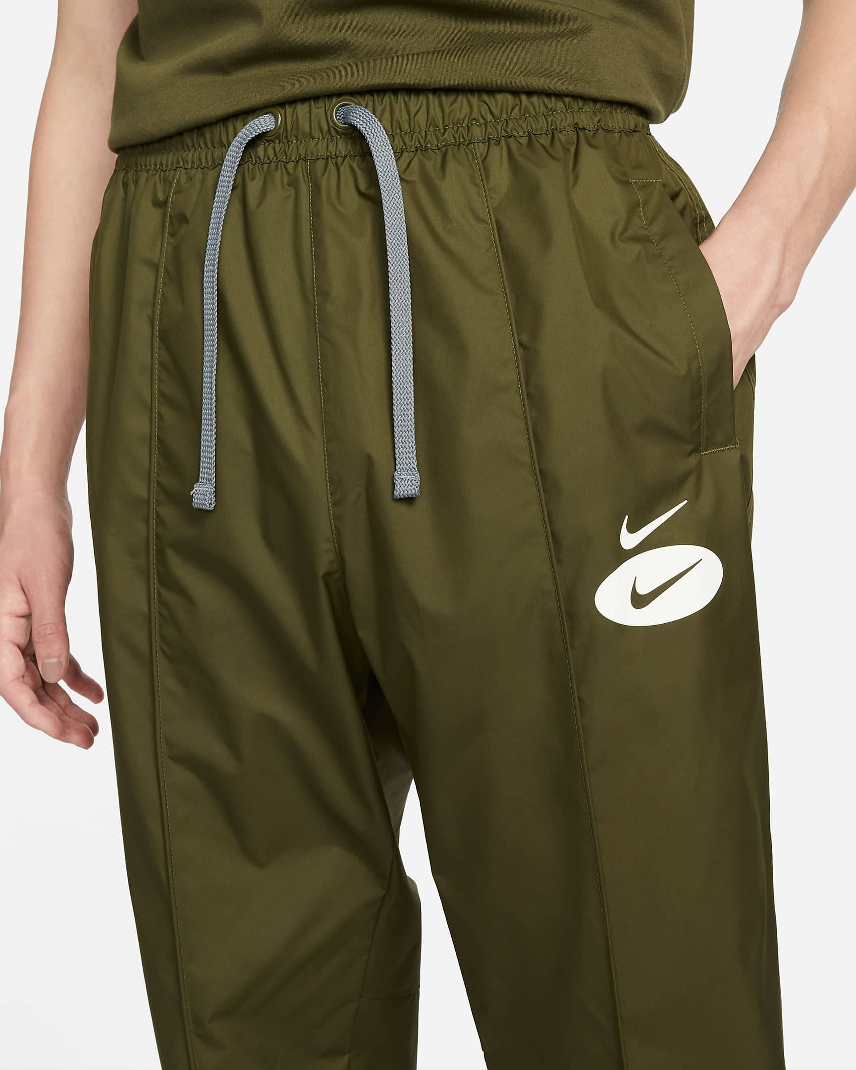 Nike swoosh cuffed discount woven sweatpants in khaki