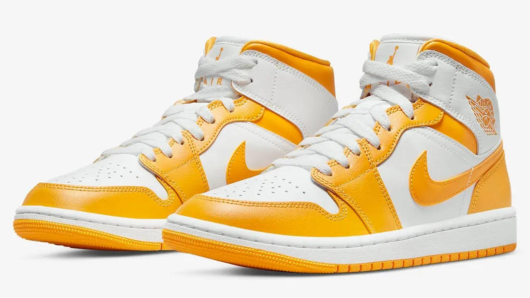 white and yellow jordans 1