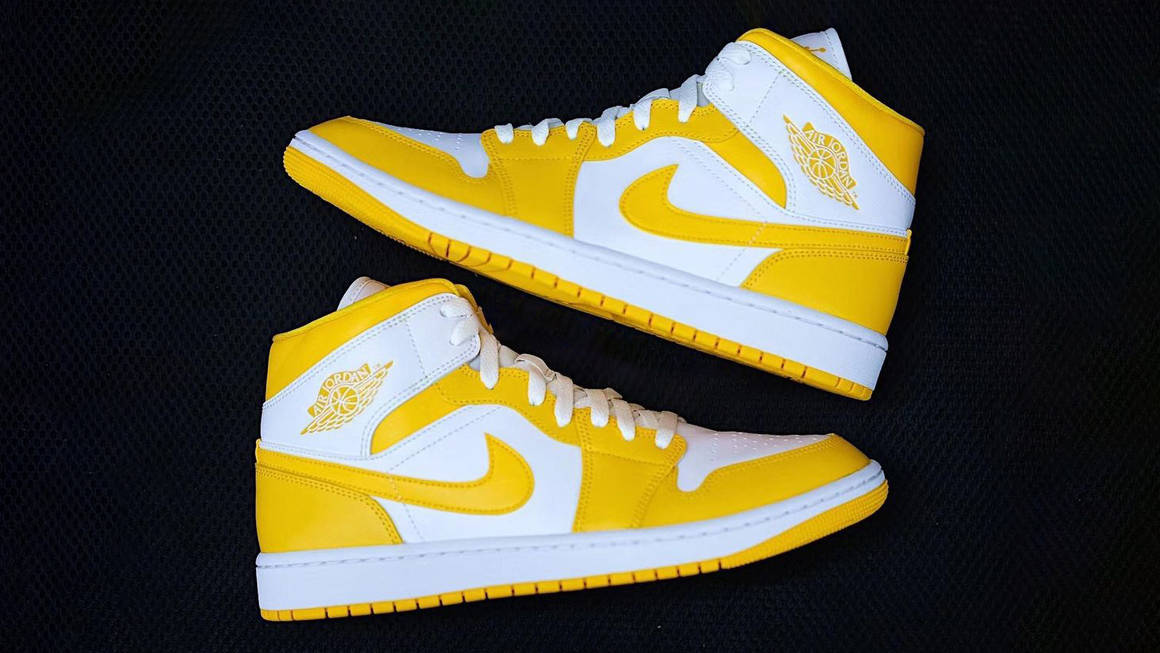 white and yellow jordans 1