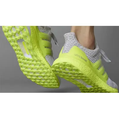 Ultra boost clima hot sale solar yellow on feet