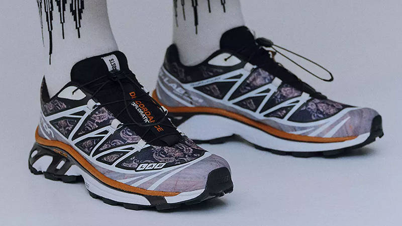 Children of the Discordance x COSTS x Salomon XT-6 White Blue on feet
