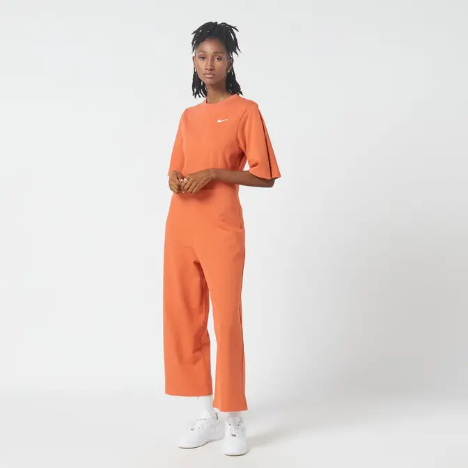 https://cms-cdn.thesolesupplier.co.uk/2022/06/nike-sportswear-jumpsuit-orange-full_w672_h672.jpg.webp