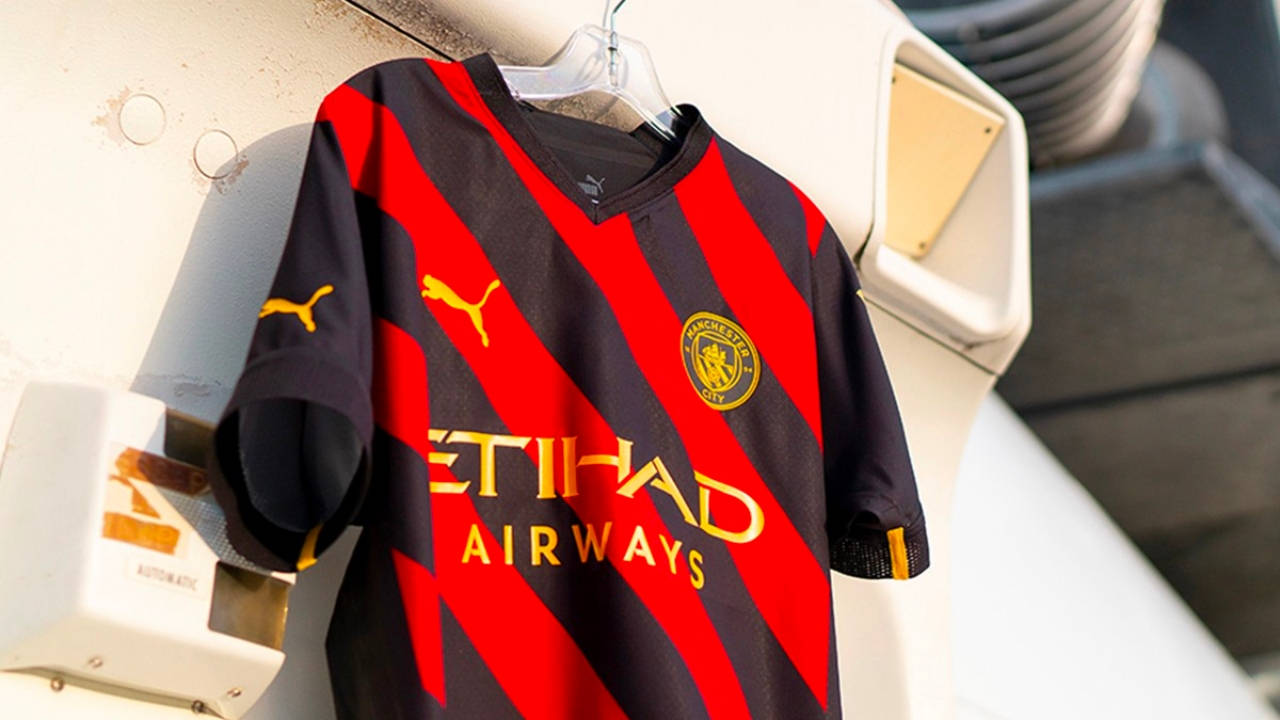 Manchester City Debuts Its Red and Black 2022/23 Away Kit