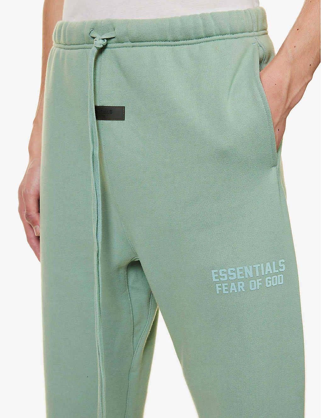 Fear of God ESSENTIALS Slim-Fit Tapered Logo-Flocked Cotton-Blend Sweatpants Sycamore Closeup