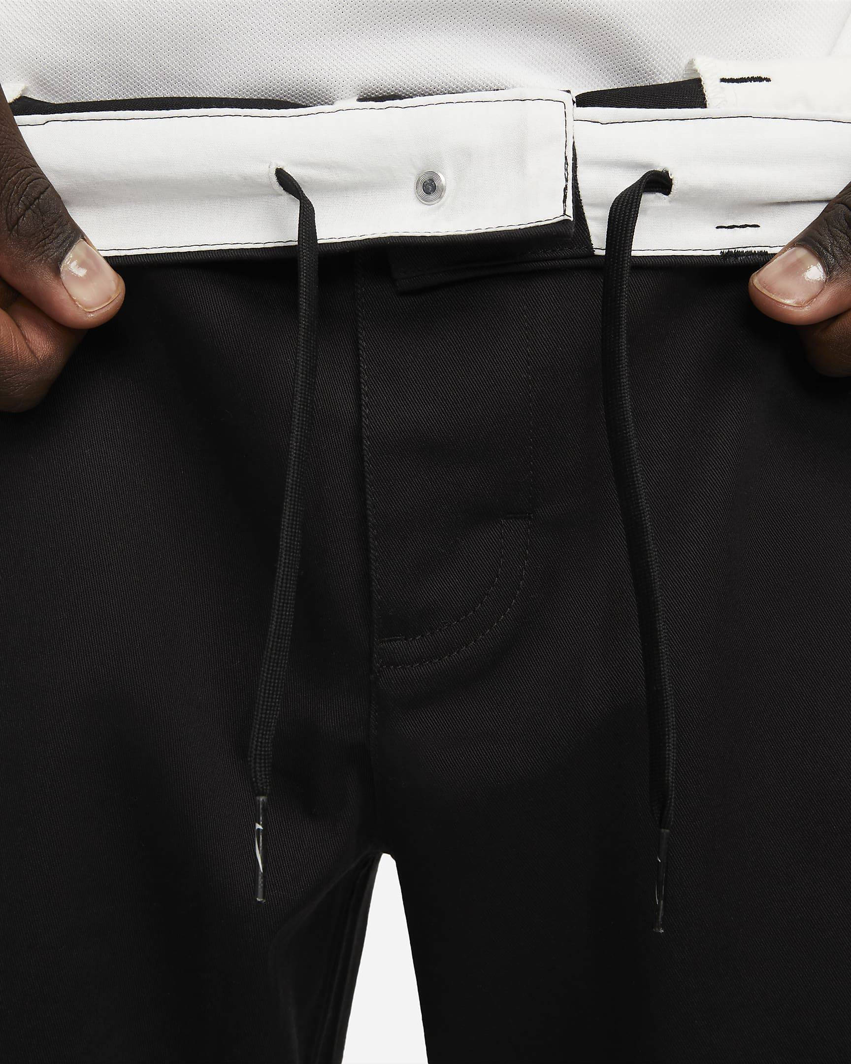 Nike Life Unlined Cotton Chino Trousers Black Front Lace Closeup