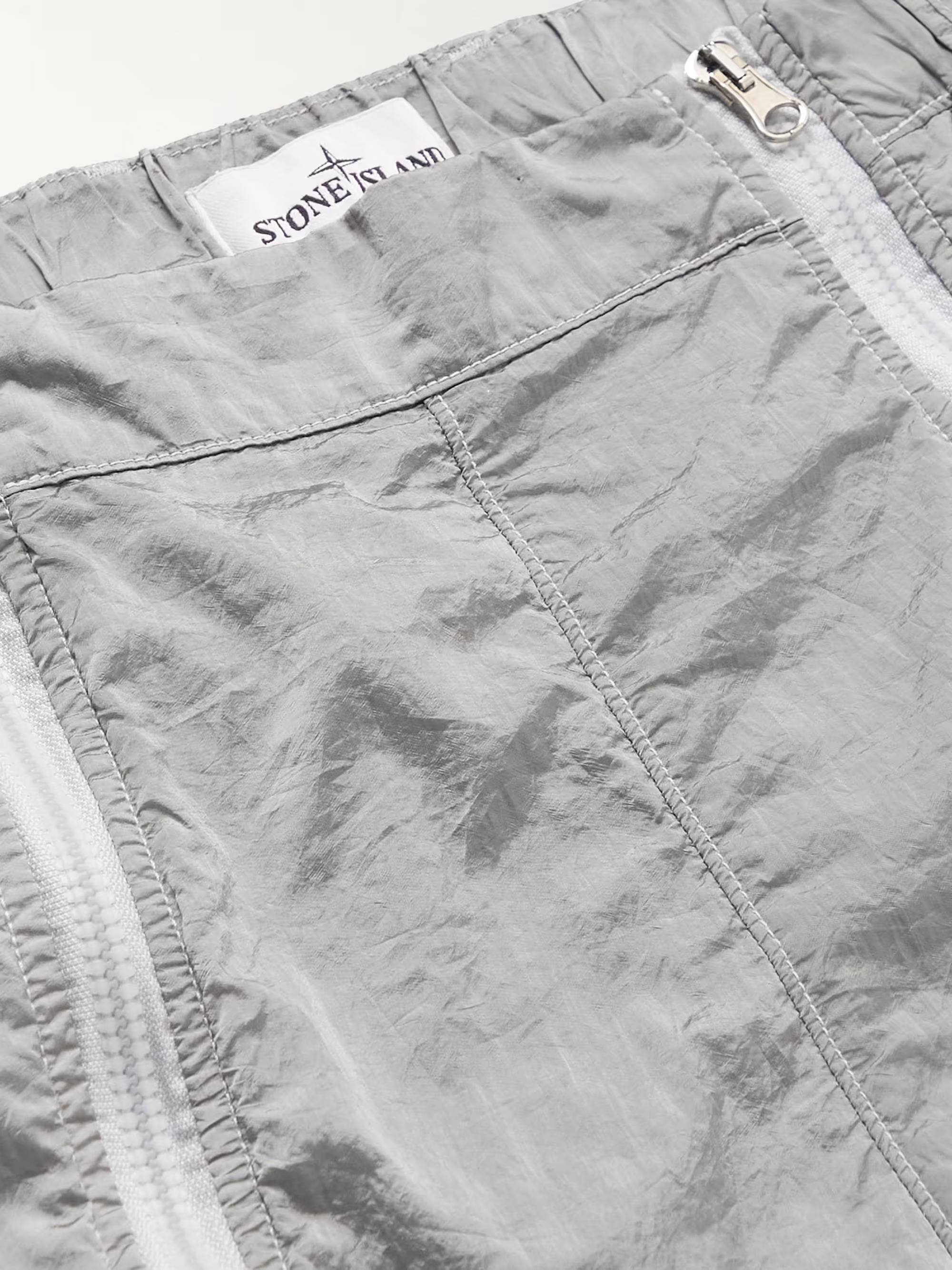 Stone Island Tapered Logo Appliquéd Zip Detailed Shell Cargo Trousers Grey Front Closeup
