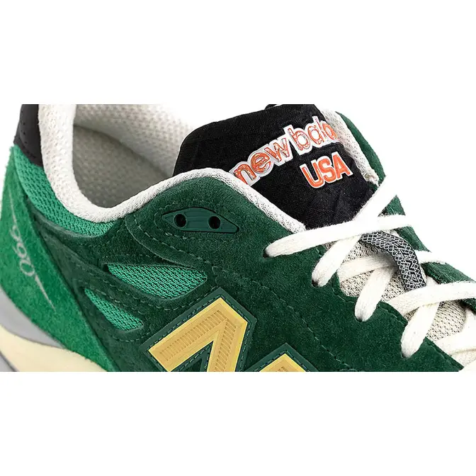 New balance green store gold