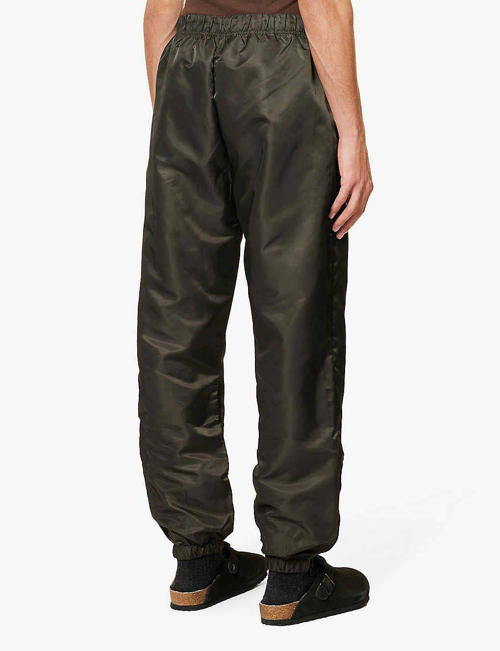 Fear of God ESSENTIALS Tapered Shell Jogging Bottoms Off Black Back